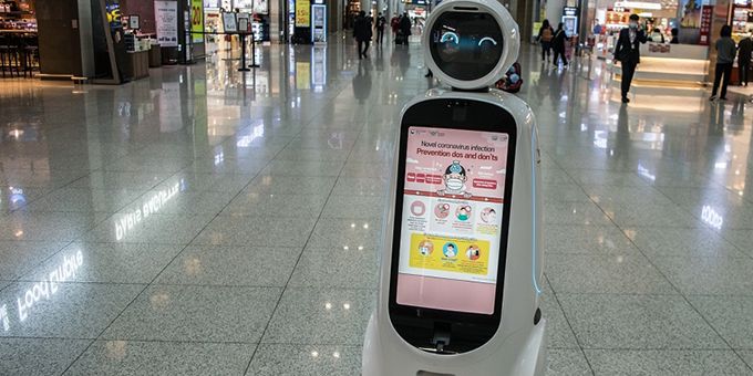 Photo of a robot roaming a mall