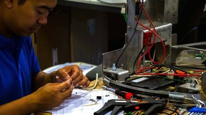 An engineer working on components for an automated vehicle system